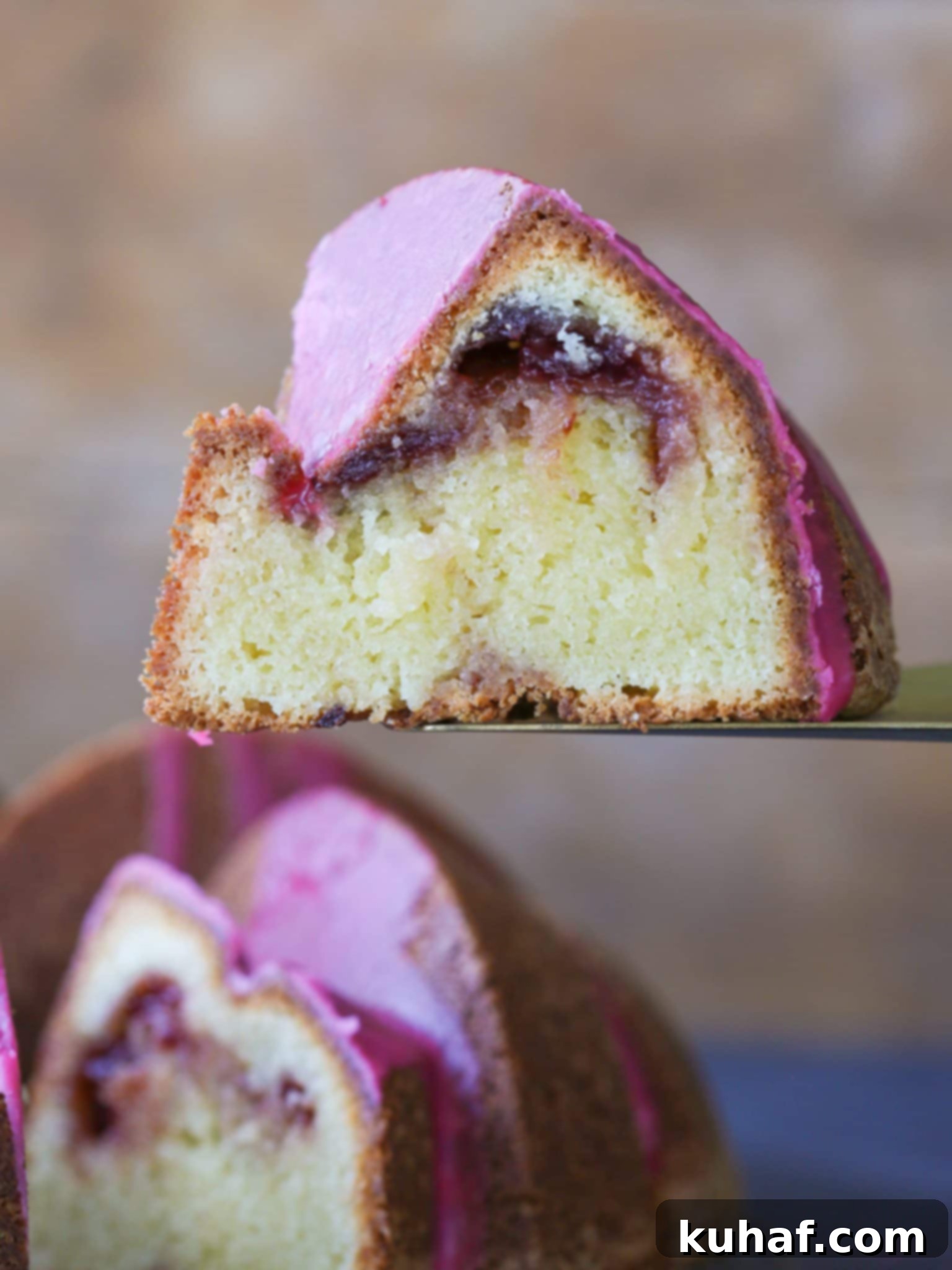 Cherry Almond Pound Cake, beautifully glazed, on a cooling rack