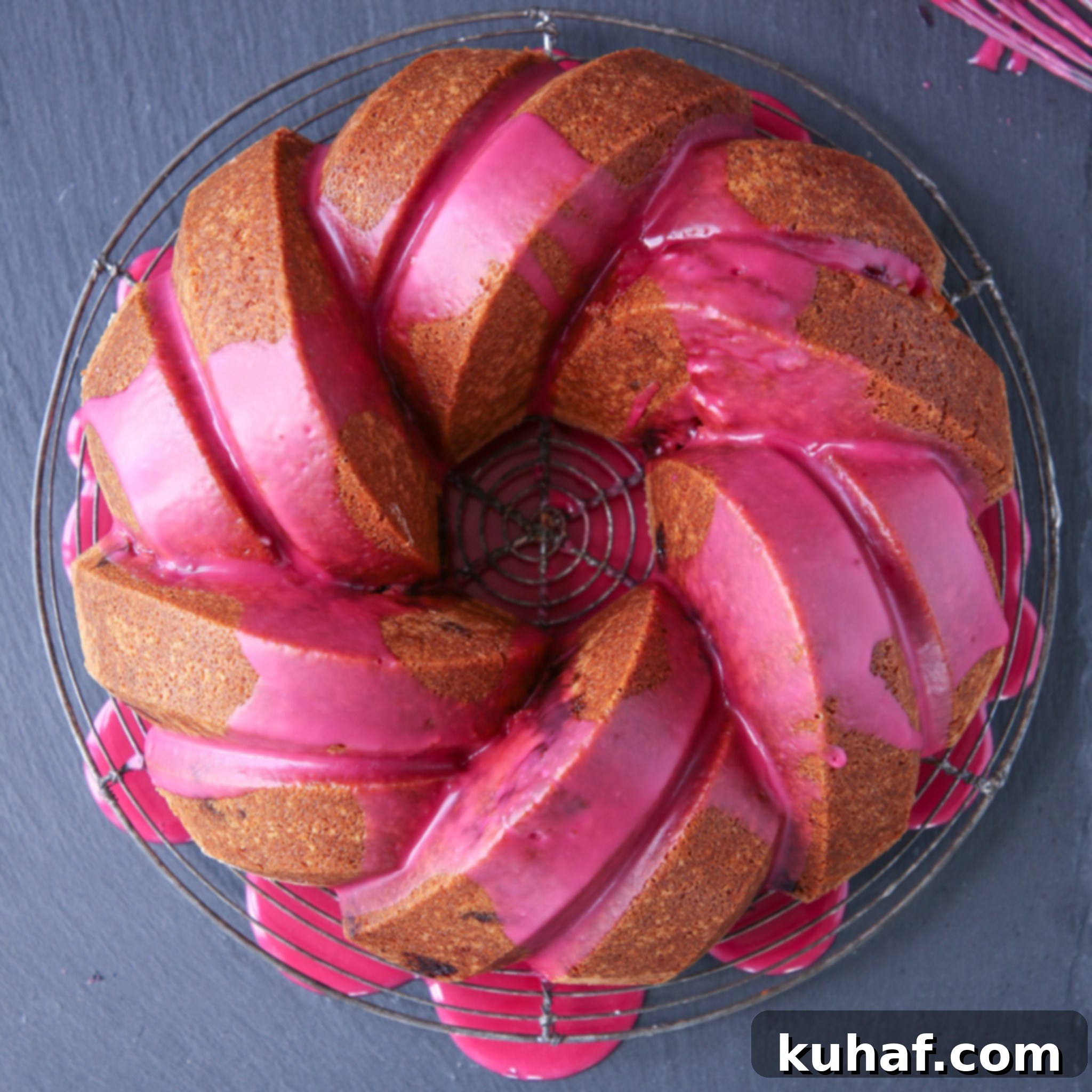 Cherry Almond Bundt Cake, fully glazed, on a serving platter