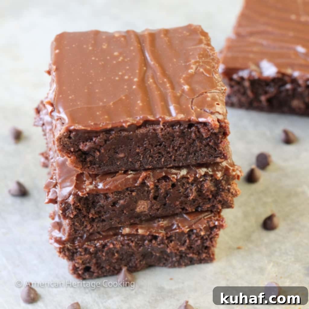Top-down view of a baking pan filled with freshly baked milk chocolate brownies and ganache