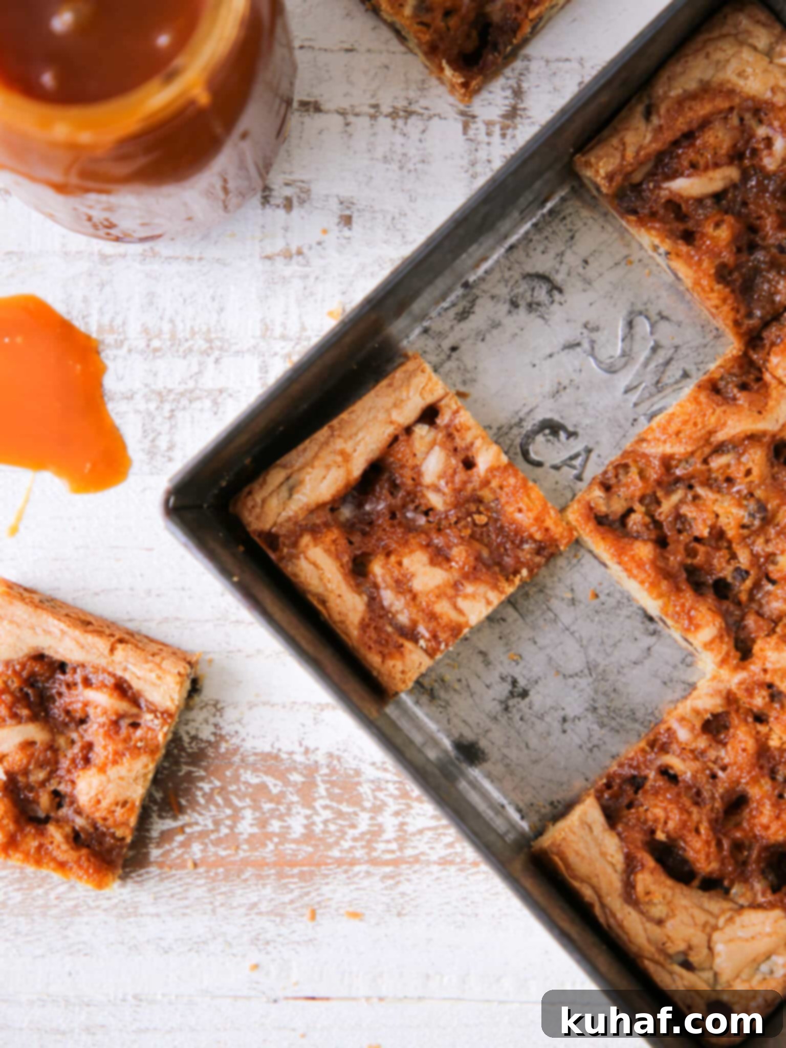 Caramel Chocolate Chip Blondies sliced in vintage baking pan