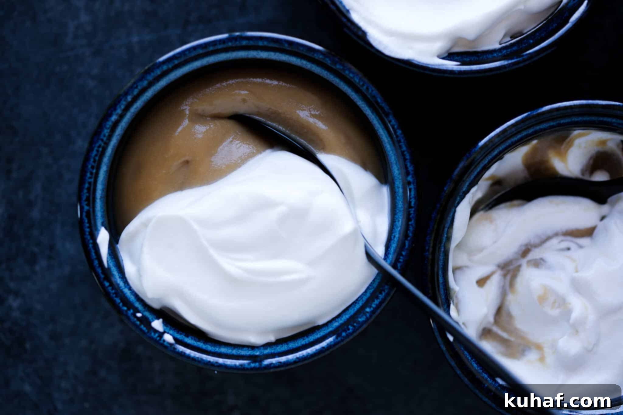 Butterscotch pudding in a serving bowl with a spoon.