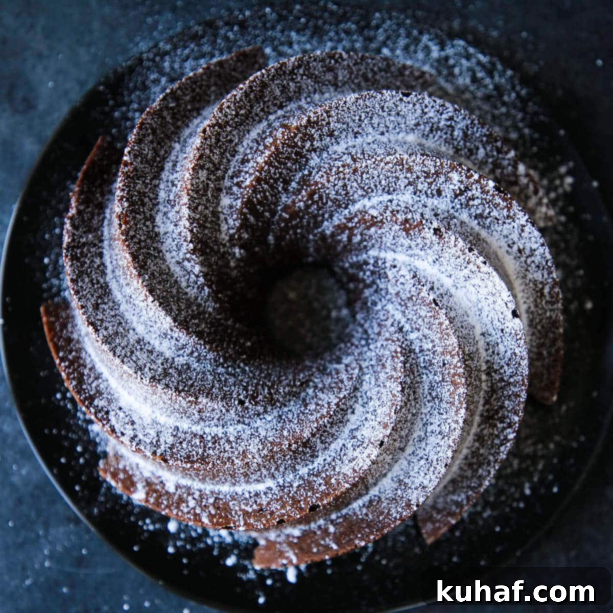 An uncut fluted chocolate pound cake.