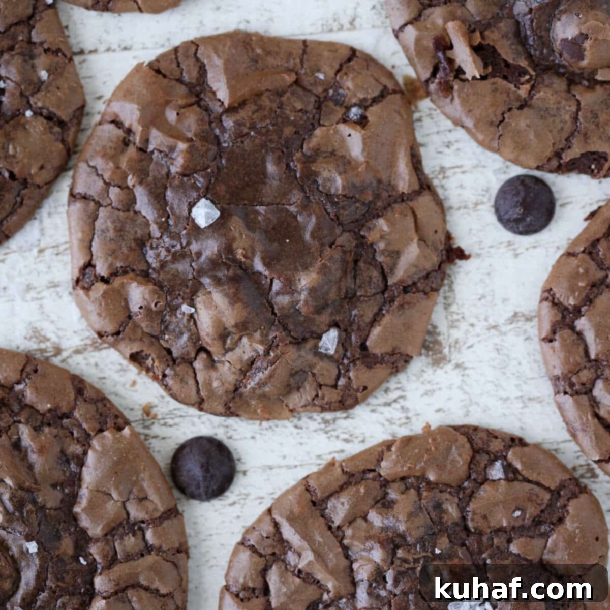 Stack of fudgy brownie cookies with a perfectly crackled top, highlighting their professional-grade appearance.