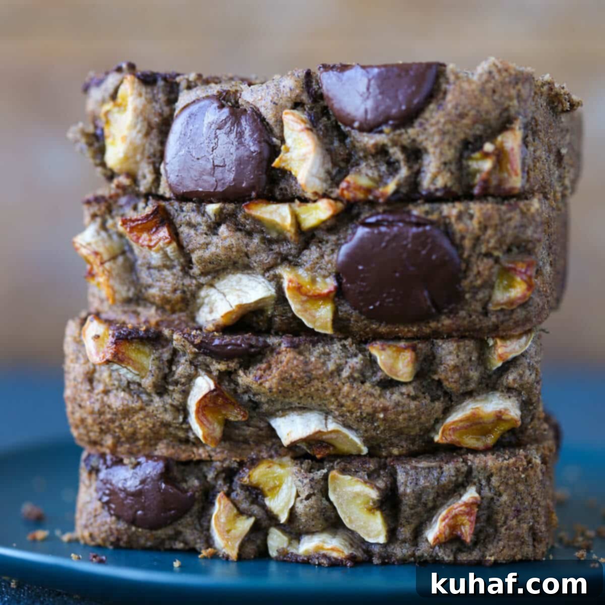 Stack of vegan chocolate chip banana bread slices, ready for a delicious breakfast or snack