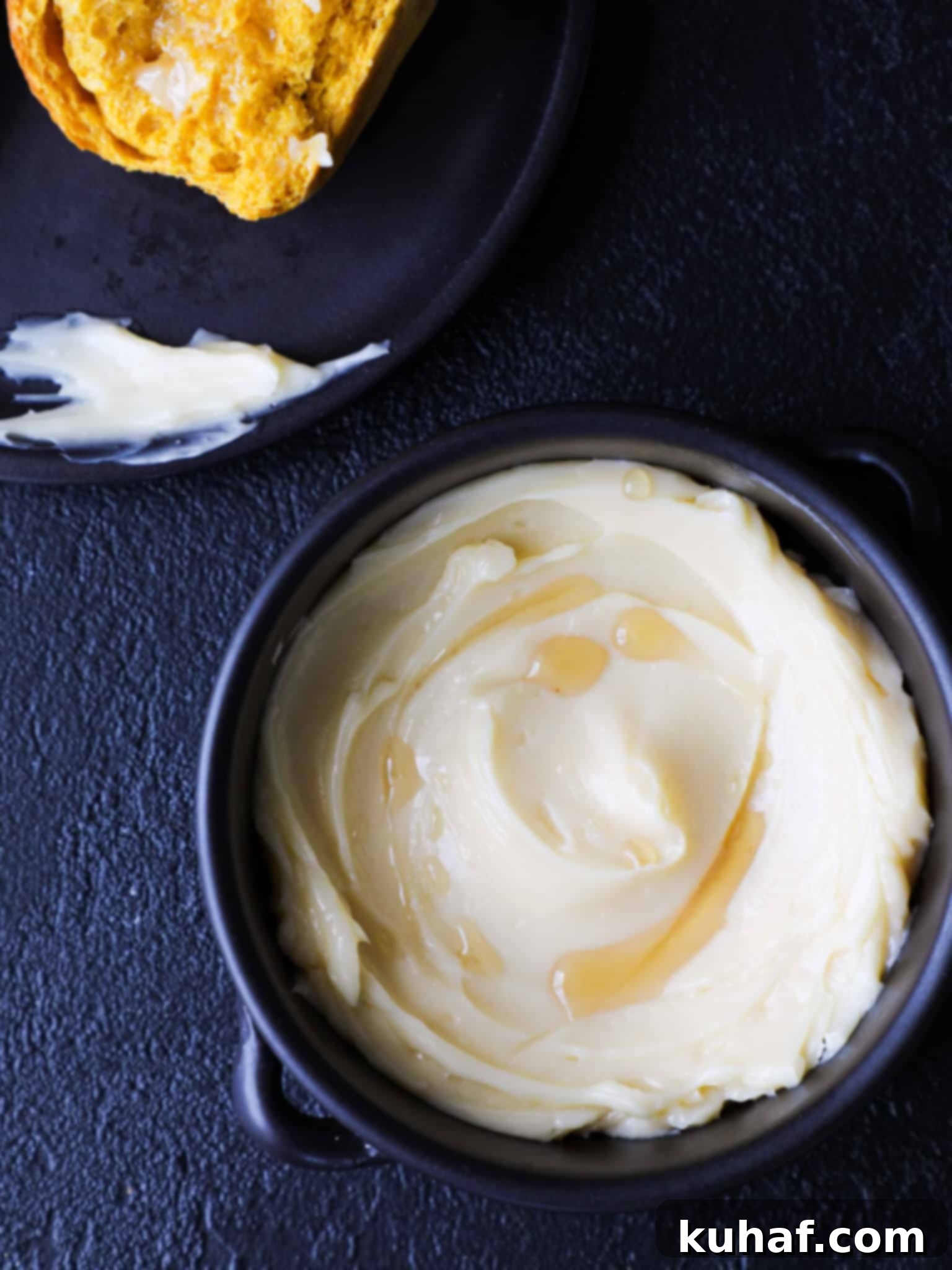 Artisan Maple Butter 5 Homemade Maple Butter with a delicate drizzle of maple syrup over it, highlighting its rich, sweet nature and smooth texture.