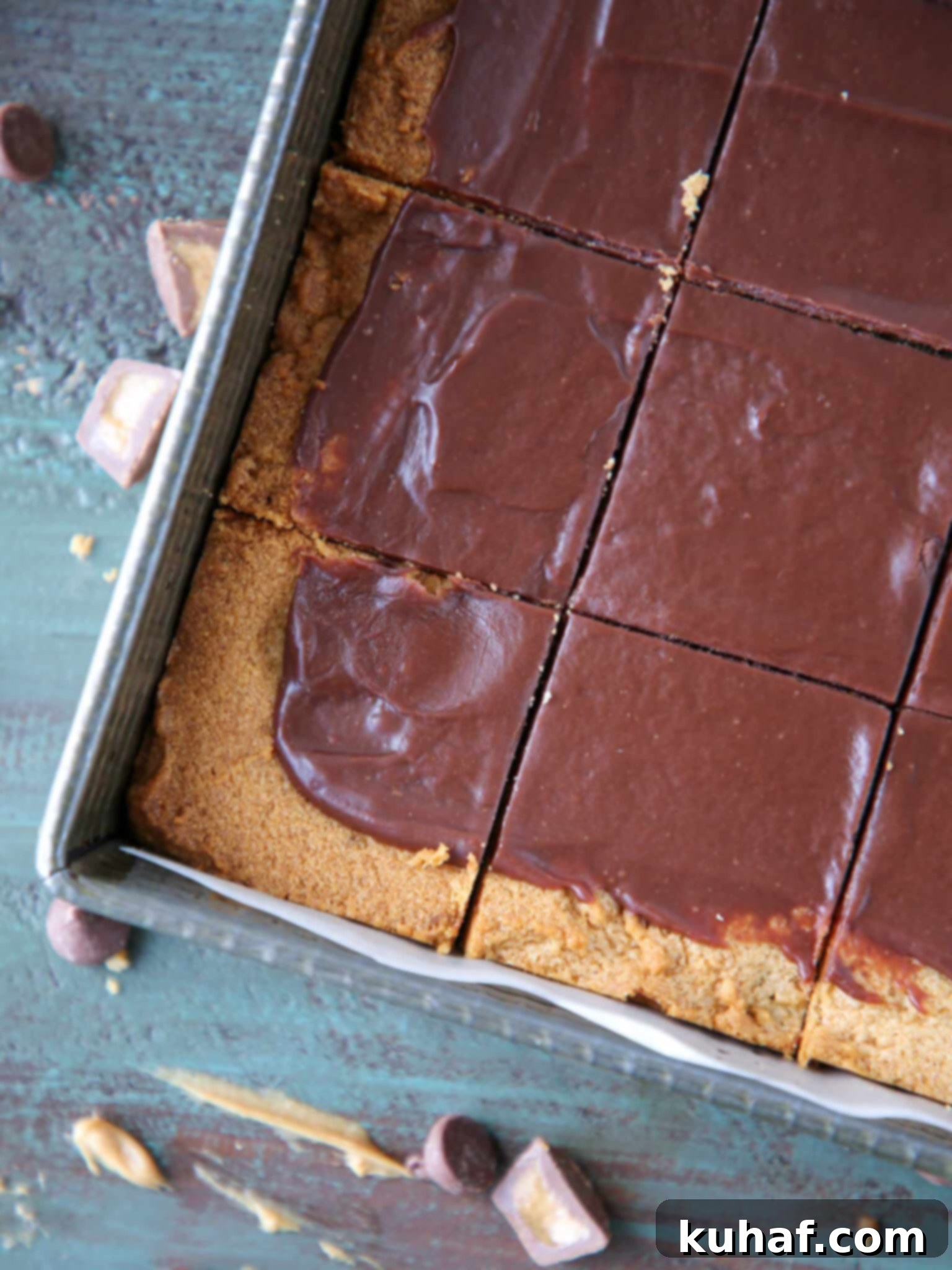 Fudgy Peanut Butter Reeses Chocolate Bars sliced and arranged in a vintage baking tin
