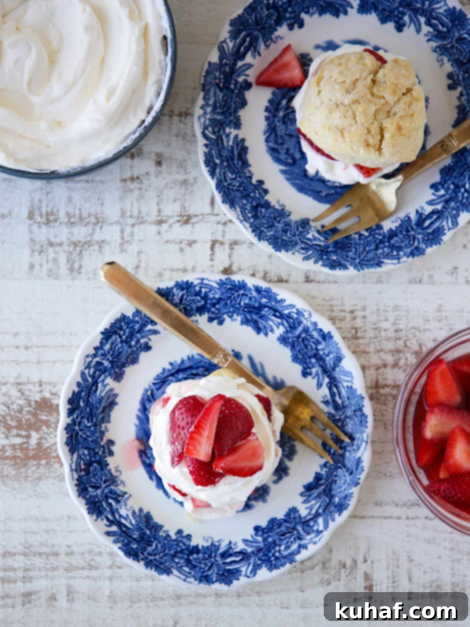Strawberry Shortcake Solo 2 Strawberry Shortcake for Two blue china plates, featuring a beautifully assembled individual shortcake with whipped cream and fresh strawberries.