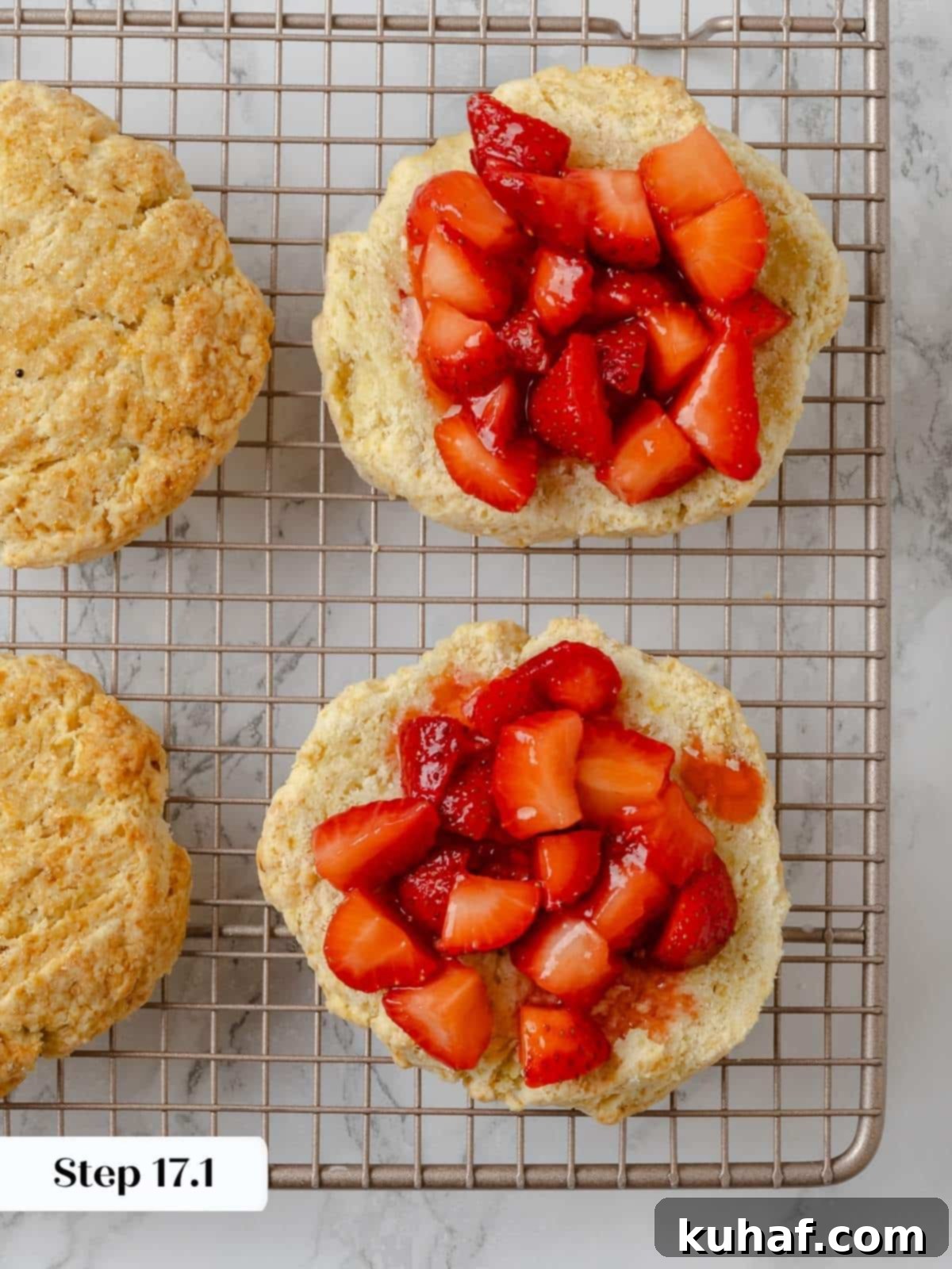Strawberry Shortcake Solo 15 Fresh strawberries layered over shortcake biscuits in the assembly stage, ready for whipped cream.
