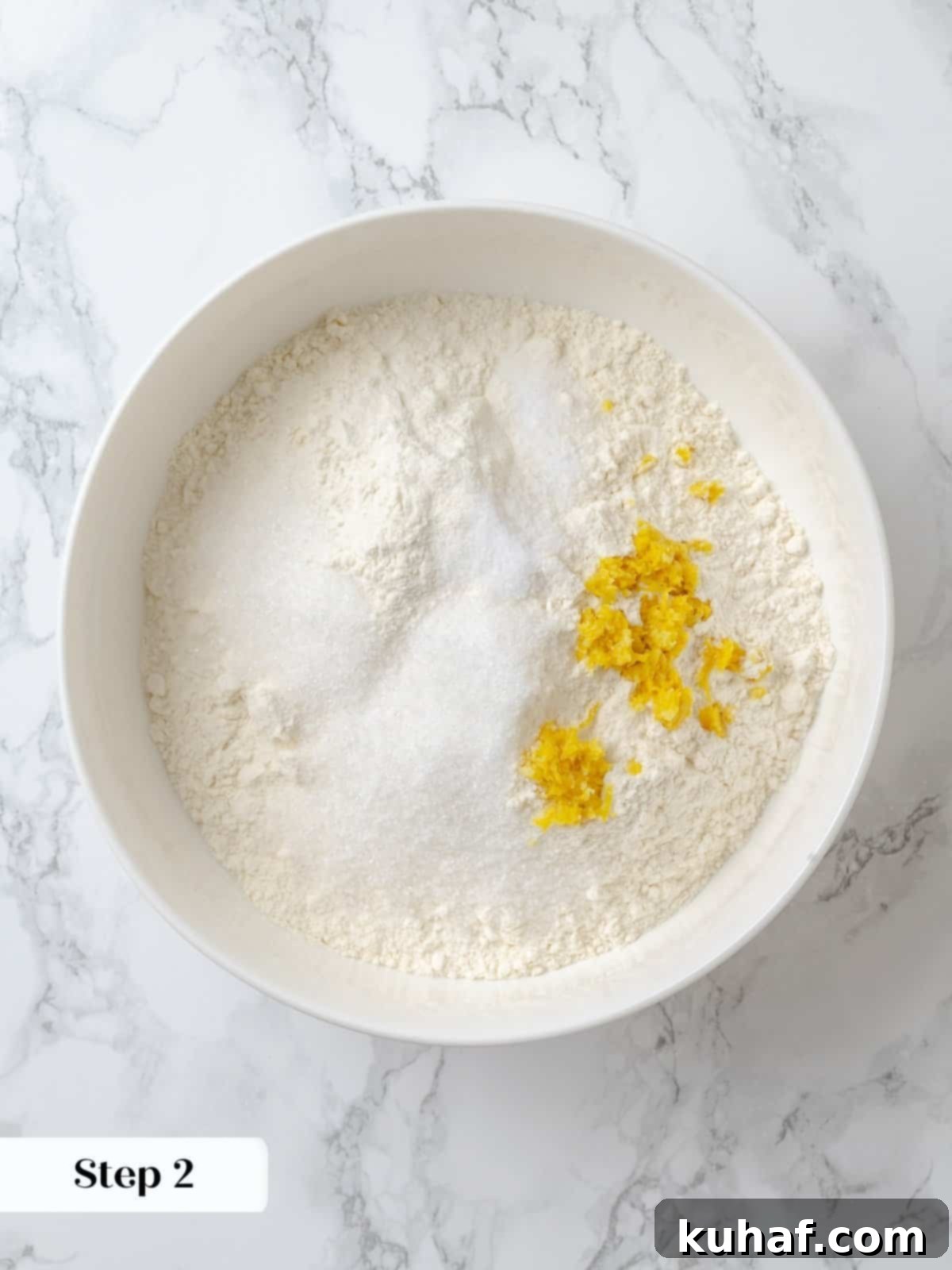 Strawberry Shortcake Solo 5 Blending dry ingredients evenly to prep for shortcake dough, showing flour, sugar, baking powder, and salt in a bowl.