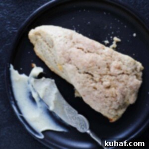 Warm Spiced Apple Scones 7 Spiced apple scones with perfect cream on top, ready to be served.