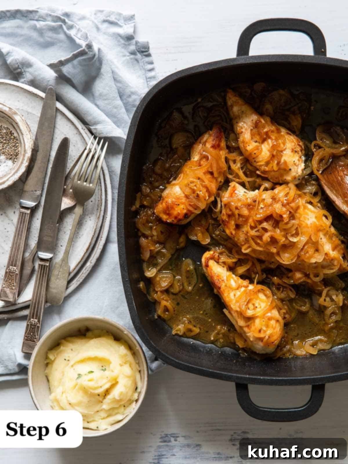 Step 6 of the process, baking the chicken in the oven in a cast iron pan.