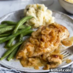 Baked Chicken and Shallots on plate with green beans and mashed potatoes