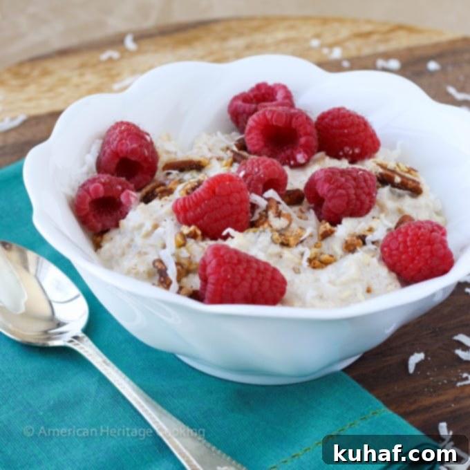 A serving of Bircher Muesli in a bowl with fresh fruit and a spoon.