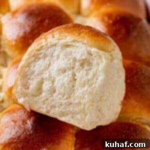 A single Hawaiian roll, soft and sweet.