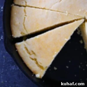 Slices of Southern Cornbread in a black cast iron skillet, golden and ready to serve.