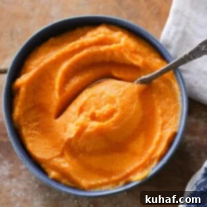 Creamy Maple Mashed Sweet Potatoes presented beautifully in a blue bowl.