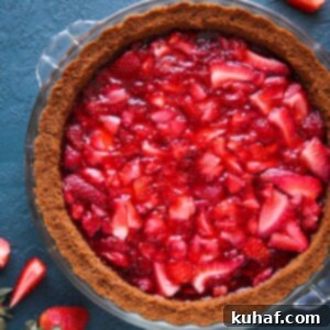 A vibrant No Bake Strawberry Triumph Pie with a unique Gingersnap Crust, offering a delightful twist on a classic dessert.