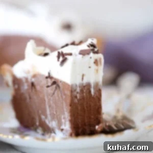 A delicious slice of French Silk Pie, showcasing its rich, creamy texture and enticing appearance.