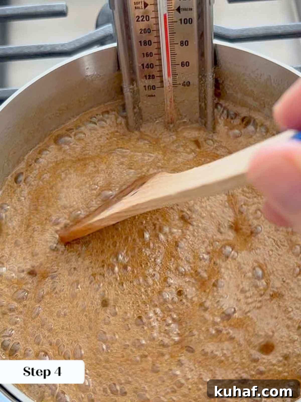 boiling pecan praline candy with thermometer.
