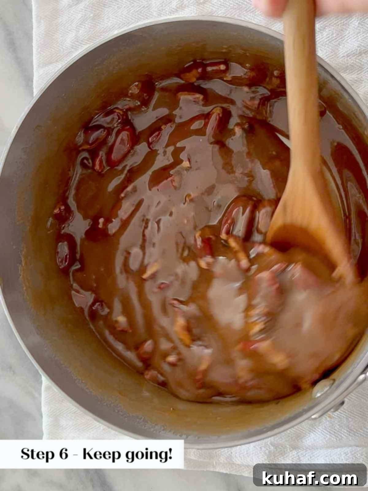 stirring pecans and candy mix. 