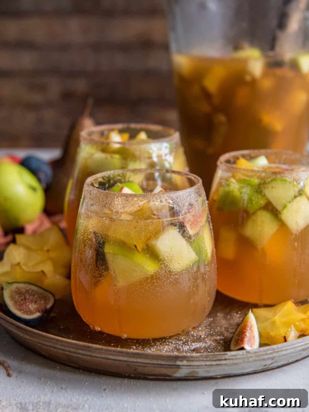 pear apple fig white wine sangria in glasses.