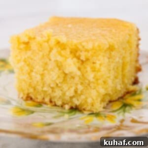 sweet cornbread slice on vintage plate with yellow flowers.