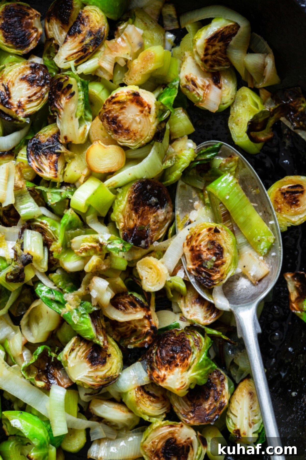 Brussels Sprouts and Leeks with Lime ginger butter close up on spoon