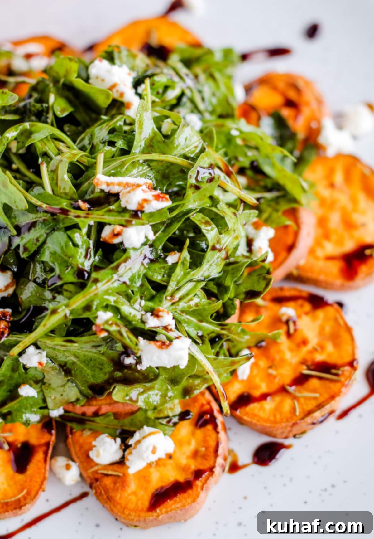 arugula salad with sweet potatoes and balsamic drizzle.