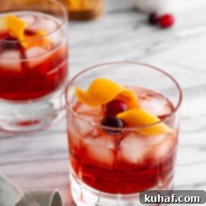 a holiday negroni on a marble countertop.