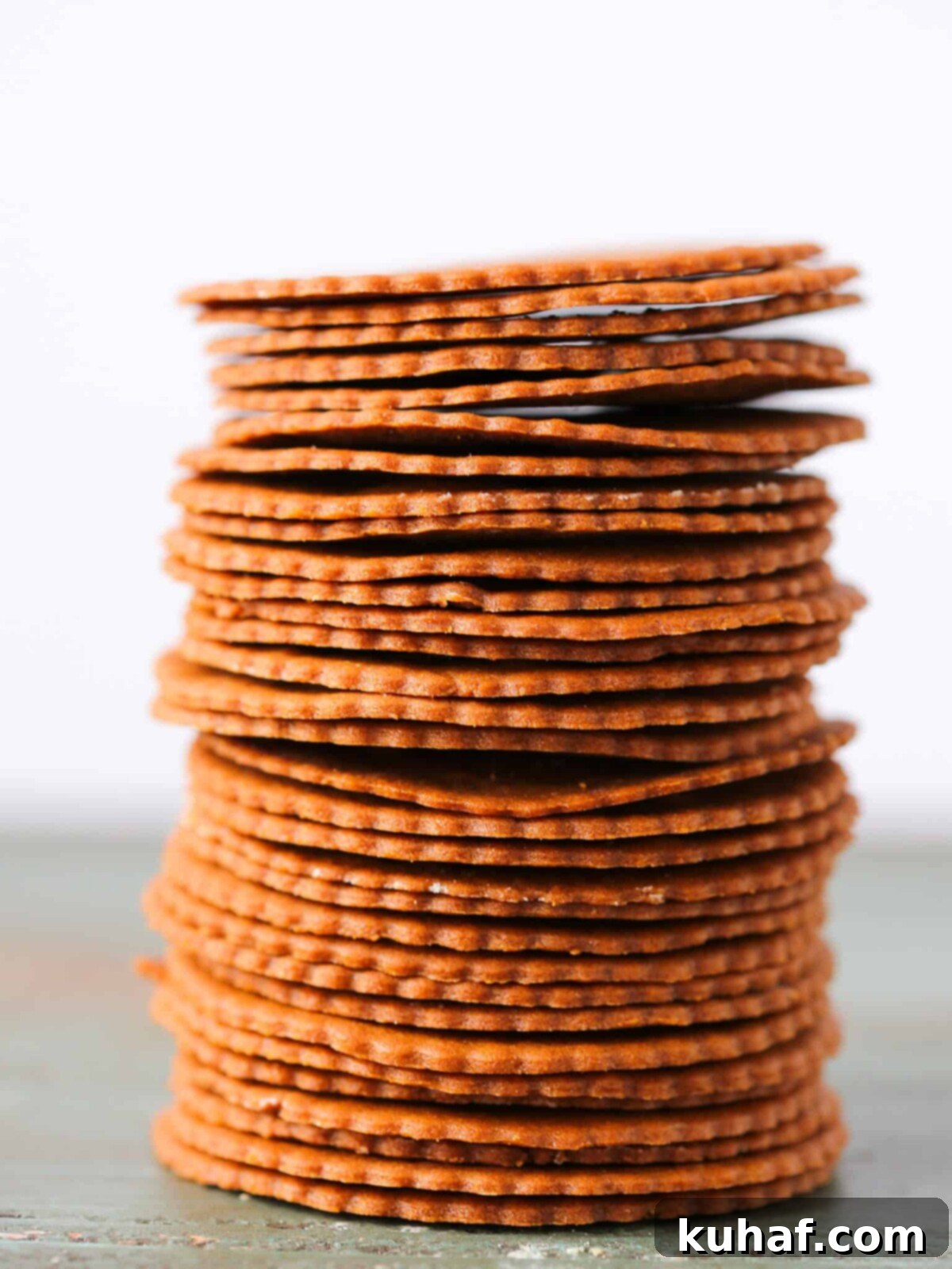 Moravian Christmas Cookies stacked tall white background.