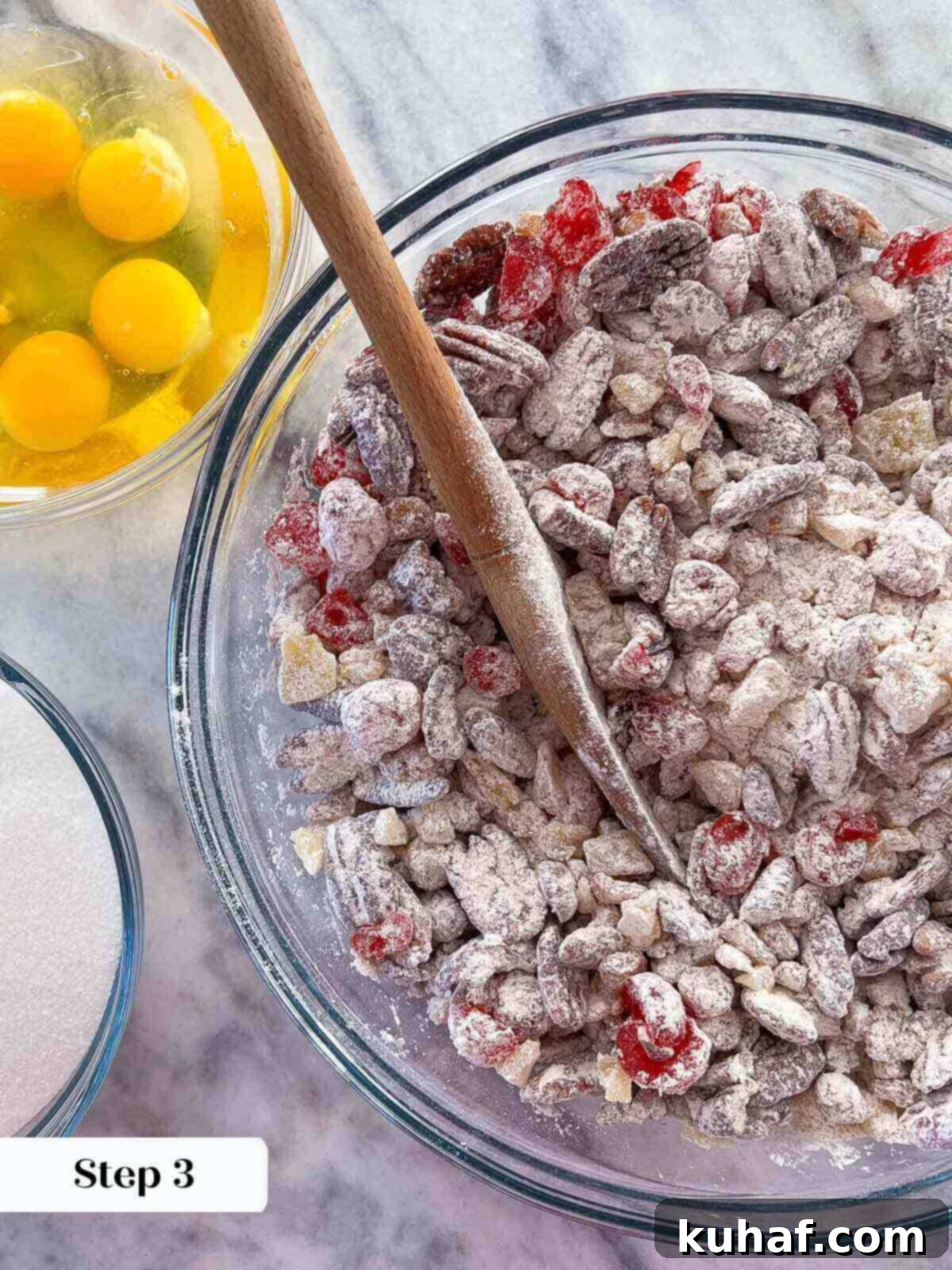 Chopped dried fruits and nuts lightly tossed with flour in a bowl, prepared for baking.