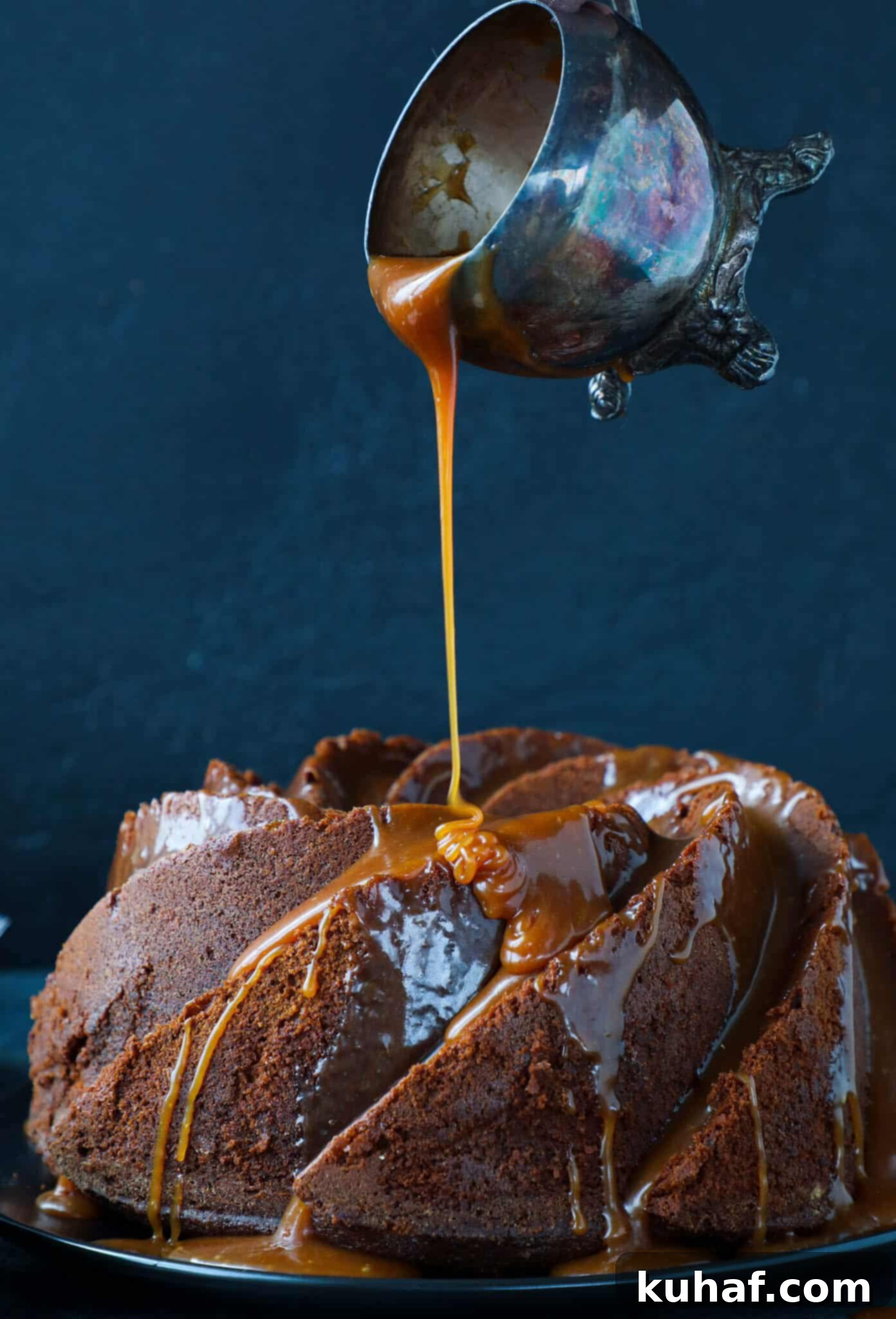 Caramel Molasses Pound Cake Pouring Glaze - Hand pouring caramel sauce over a bundt cake.
