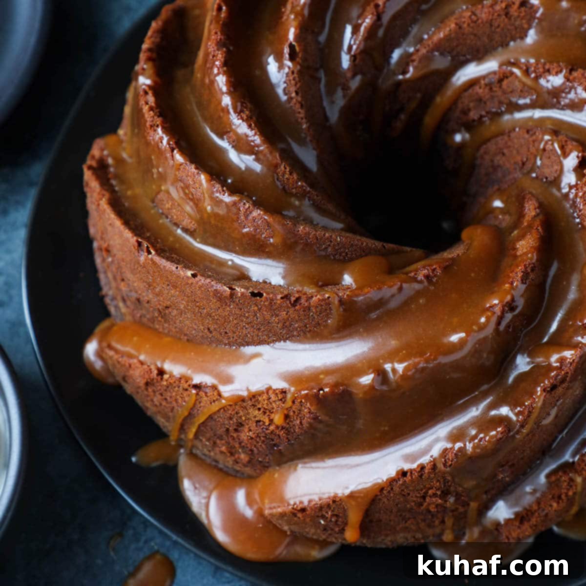 Bundt Dessert Closeup - A close-up shot of the pound cake's intricate bundt design and moist texture.
