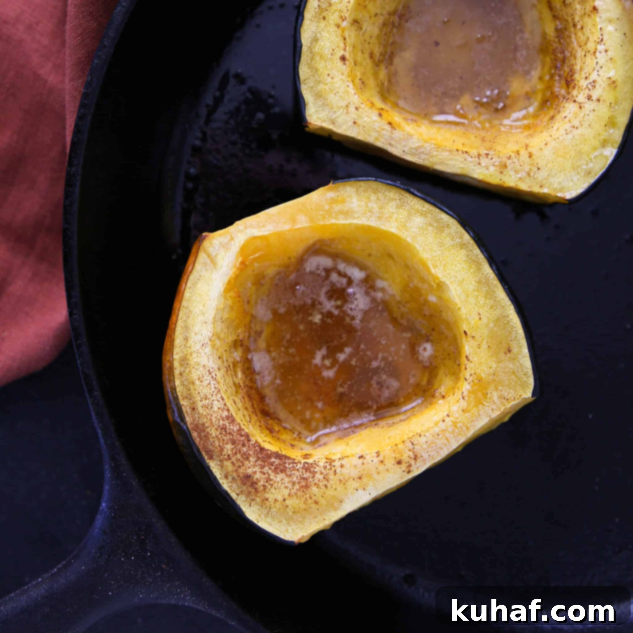 Brown Sugar Baked Acorn Squash Two Halves, an aerial view of two perfectly baked acorn squash halves, garnished and ready to be served.