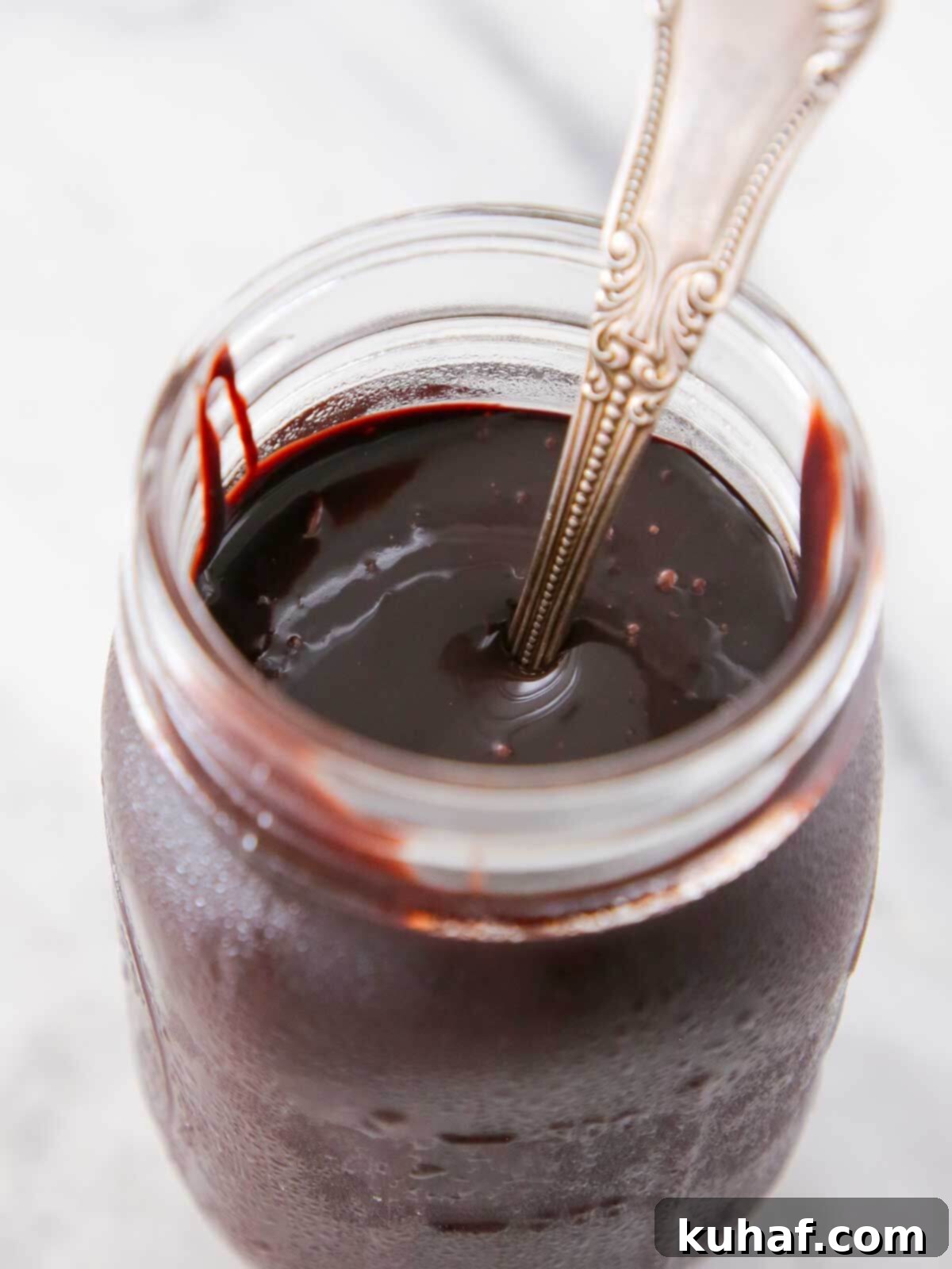 Quick Chocolate Treats 16 chocolate fudge sauce in jar with spoon.