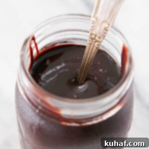 Quick Chocolate Treats 17 chocolate fudge sauce in jar on marble.