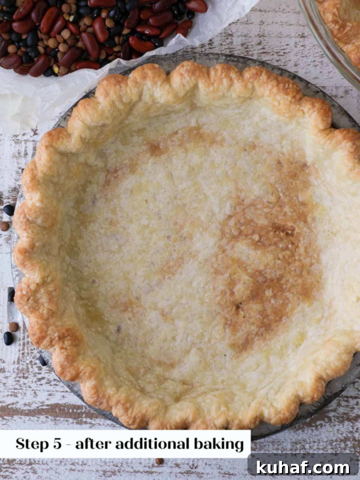perfectly partially baked pie crust, golden brown and unfilled.