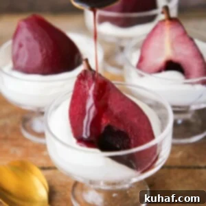 Romantic Valentine's Desserts 8 Easy Red Wine Poached Pear Dessert with sauce pouring over.