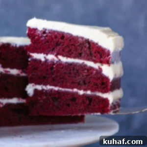 Romantic Valentine's Desserts 20 Red Velvet Layer Cake with Cream Cheese Buttercream slice on a cake server.