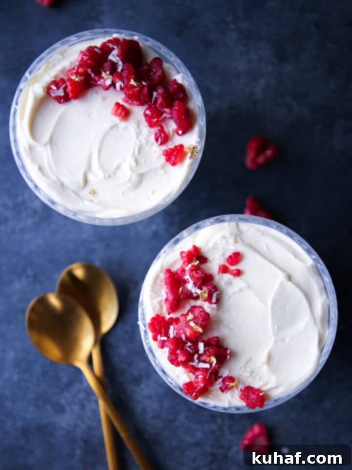 Romantic Valentine's Desserts 5 White Chocolate Raspberry Mousse served elegantly in two coupes, a perfect easy chocolate dessert and Valentine's Day treat.
