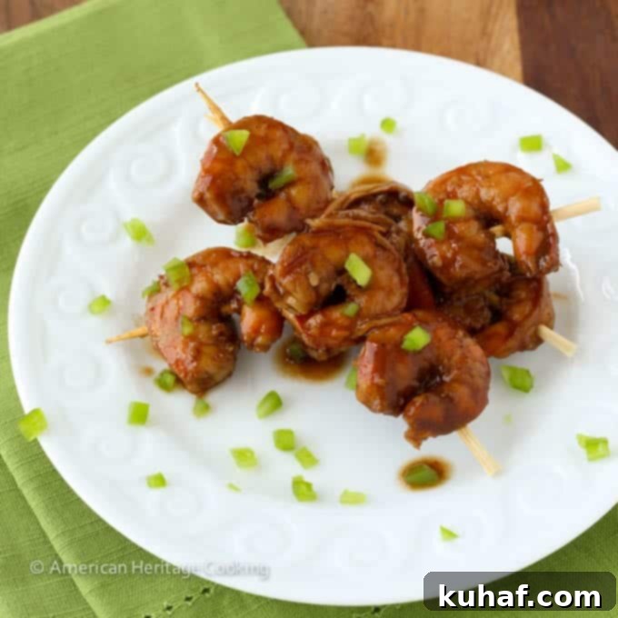 Spicy Barbecue Beer Shrimp arranged on a plate with dipping sauce
