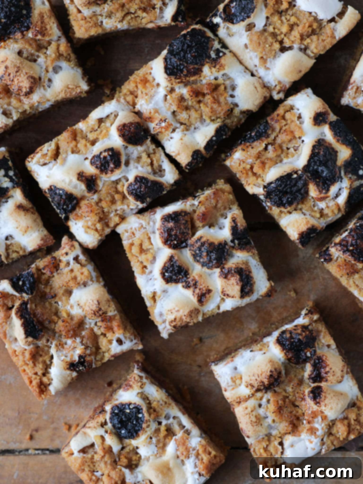Gooey S'mores Crumble Bars 3 Arrangement of Soft Chewy S'mores Crumble Bars on a rustic wooden surface