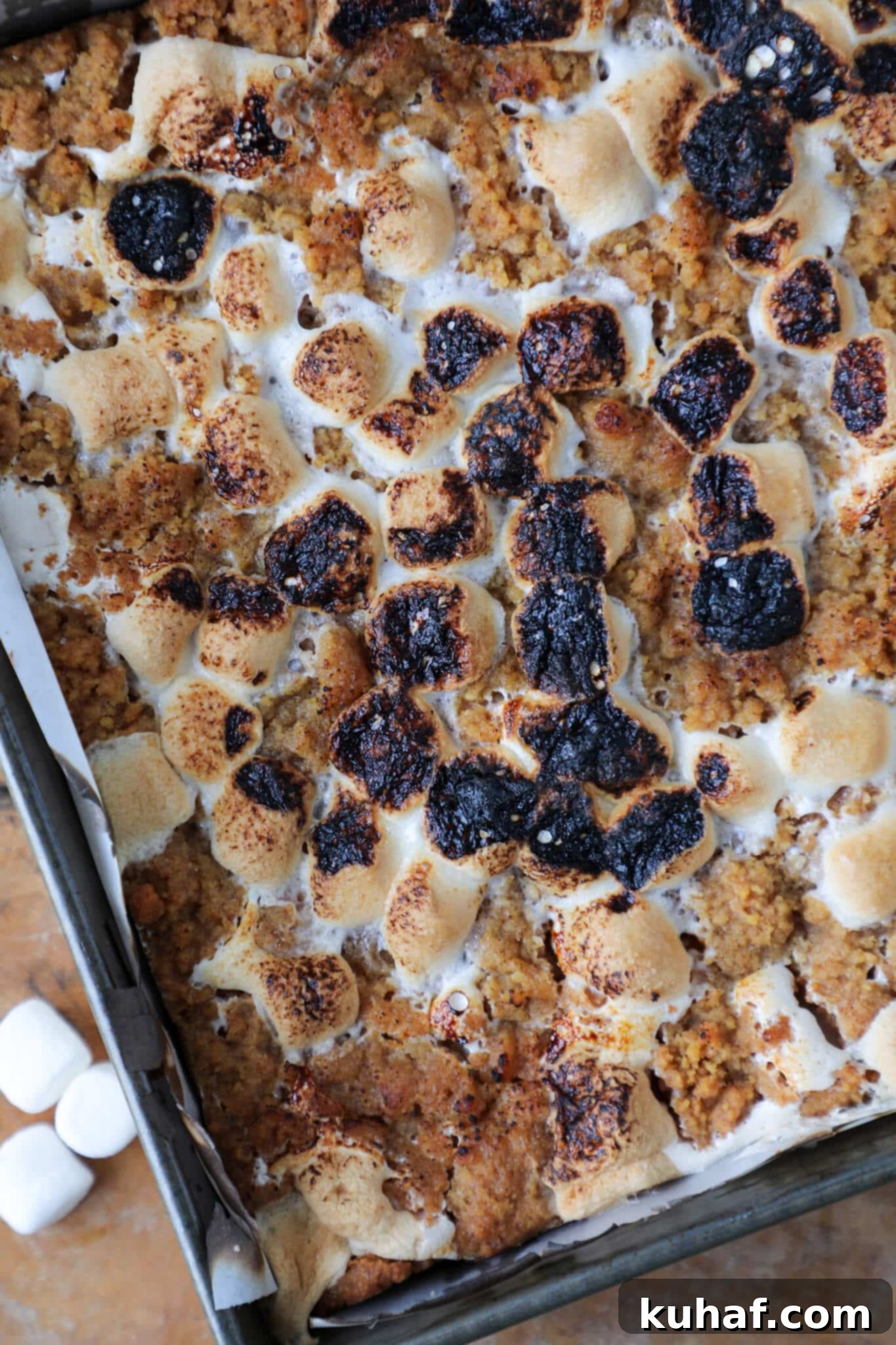 Gooey S'mores Crumble Bars 5 Whole unsliced pan of Soft Chewy S'mores Crumble Bars fresh out of the oven