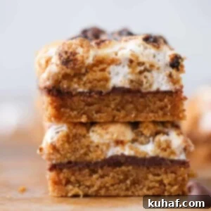 Gooey S'mores Crumble Bars 8 Soft Chewy S'mores Crumble Bars sliced and stacked, ready to eat