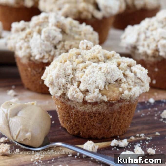 Peanut Butter Banana Muffins with Peanut Butter Streusel, spoon overflowing with peanut butter