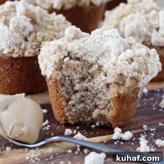 Close-up of a Peanut Butter Banana Muffin with ample streusel topping