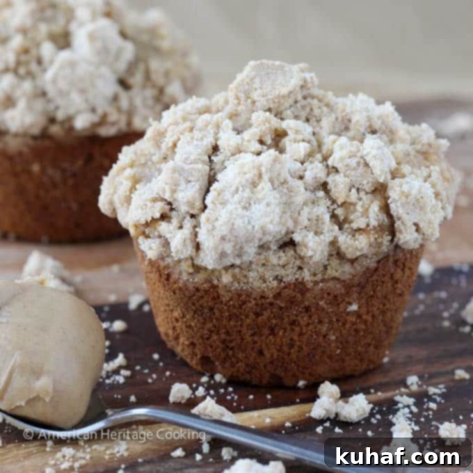 A stack of delicious Peanut Butter Banana Muffins with peanut butter streusel