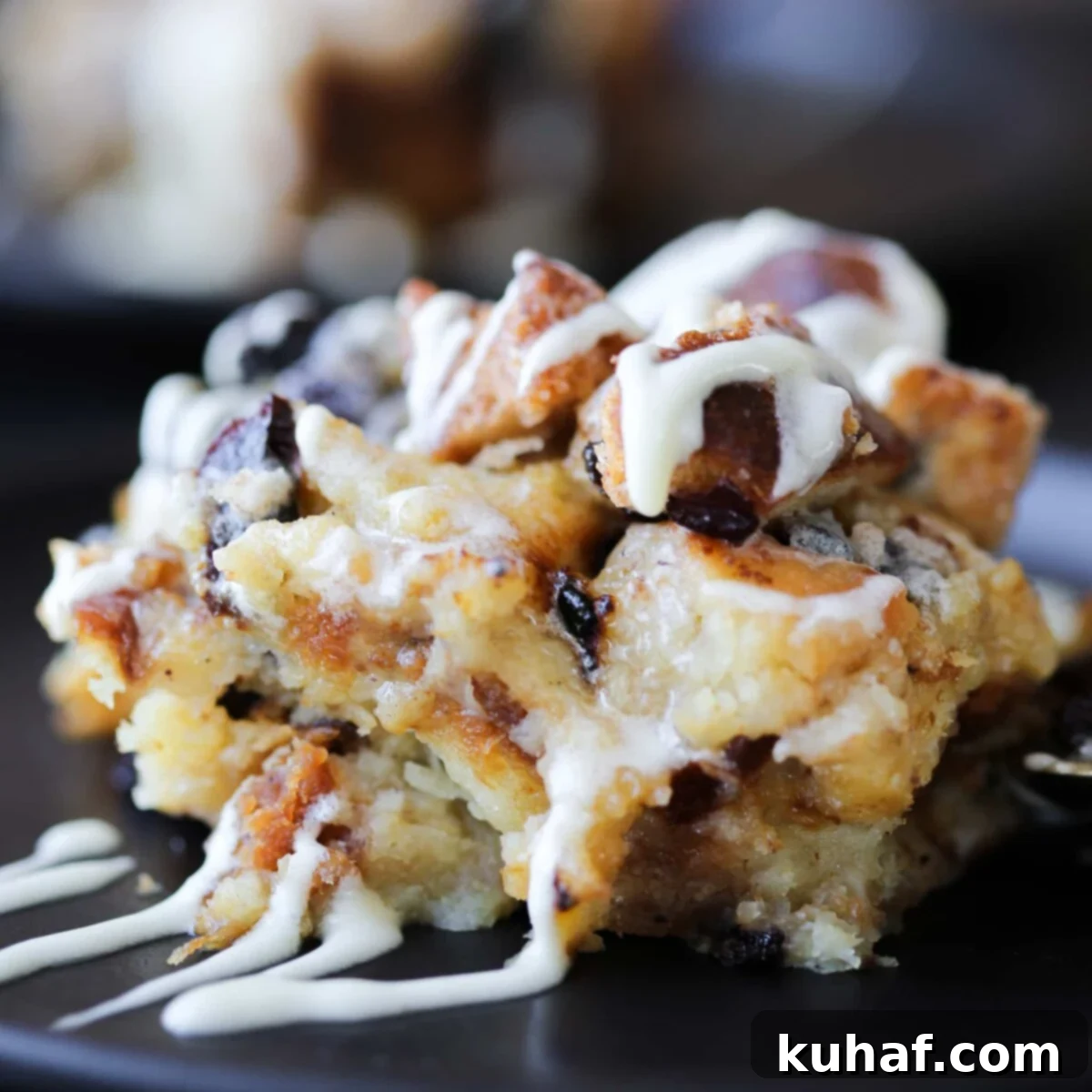 Close-up textural detail of a slice of bread pudding, showing its creamy interior and distinct bread pieces.