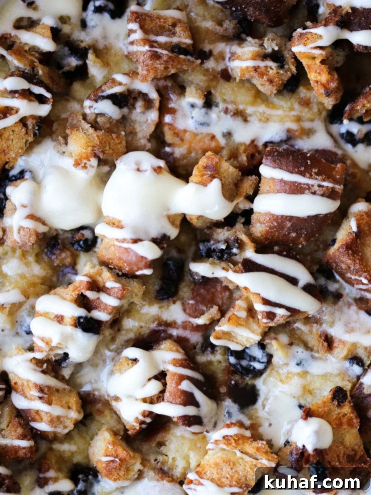 Baked bread pudding with a crunchy sugared topping in a dish, ready to be served with hard sauce.