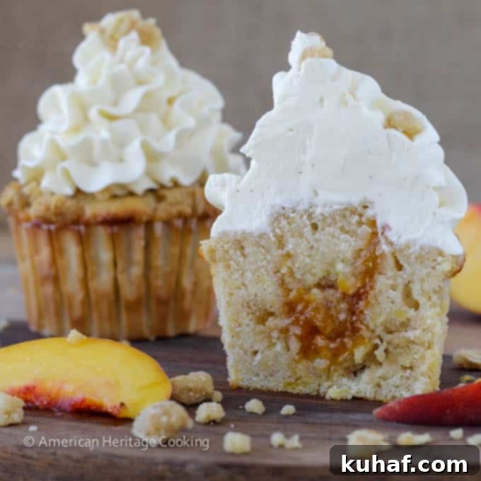 Peach Crisp Cupcakes filled with peach compote and topped with Swiss meringue buttercream